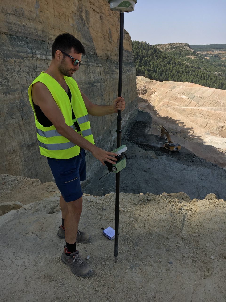 Ignacio Zapico measuring control/check points with a dGPS for a SfM photogrammetry survey in a mine