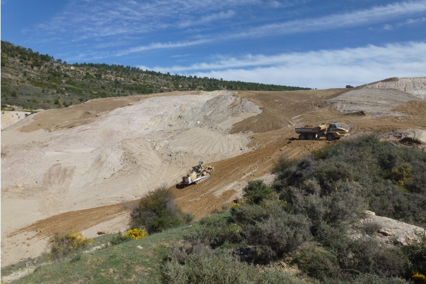 Bulldozer and truck reshaping a geomorphic rehabilitation project in the Nuria mine (Guadalajara, Spain)