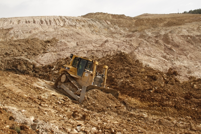 Bulldozer reshaping a geomorphic rehabilitation project in the Nuria mine (Guadalajara, Spain)