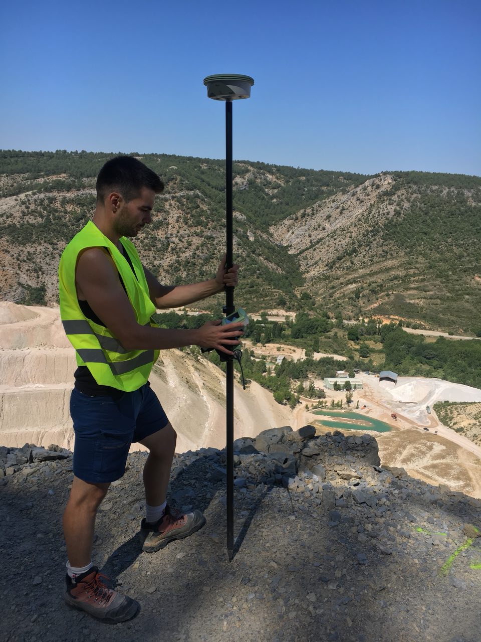 Ignacio Zapico measuring control/check points with a dGPS for a SfM photogrammetry survey in a mine